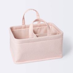 a pink basket with two compartments and handles