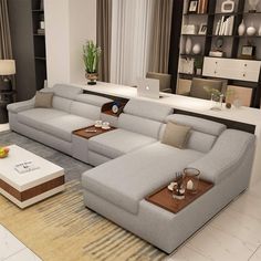 a living room filled with white furniture and lots of bookshelves on the wall