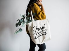 "Fresh and Local" Designed with love and printed by hand, this heavy canvas tote bag is perfect for those who love shopping local and eating fresh!Measurements:10 oz 100% cotton canvasGusset bottom17 ¾''W x 15 ¾''H x 6 ¼''DPlease feel free to send us a message for any custom requests in designs, ink colors, or sizes!Thanks for shopping handmade,Brad + Emily Recycle Design, Recycle Tote Bag, Recycled Tote, Oyster Pearl, Reduce Reuse Recycle, Garden Girls, Reuse Recycle, Big Bags