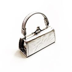 Silver Nano Bag Micro Purse Trend Tiny Purse Approx 4” Long Approx 1 1/2” Wide Nwot Small Elegant Bag With Detachable Strap, Chic Satchel Evening Bag As Gift, Elegant Small Evening Shoulder Bag, Small Elegant Bag For Everyday Use, Elegant Small Bag For Everyday Use, Small Elegant Shoulder Bag For Daily Use, Elegant Small Shoulder Bag For Daily Use, Silver Mobile Phone Bag As Gift, Chic Compact Coin Purse