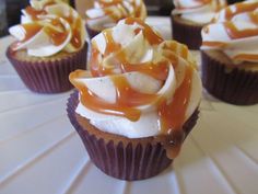 several cupcakes with caramel and white frosting