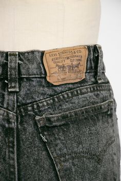 "Vintage Levi's 900 series jeans circa 1990s. Perfectly broken in, faded black denim with a slim fit, straight leg and high waist. Jeans have hand drawn graffiti like doodles. Classic 5 pocket look, levi's black tab. Metal zip and button closure. Label: Levi's student 100% cotton USA Marked size: 30 x 34 - please go by measurements See measurements to be sure. We recommend giving yourself an extra few inches for ease of fit Measurements: Waist: 31.5\" Hip: 36\" taken 7\" below waist Length: 42.5 Levi Label, Vintage Levis Jeans Black, Nude Slip Dress, Denim Cotton, Chiffon Maxi Dress, Floral Chiffon, Vintage Levis, Levis Jeans, Grey Jean