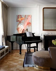 a living room filled with furniture and a piano in front of a mirror on the wall