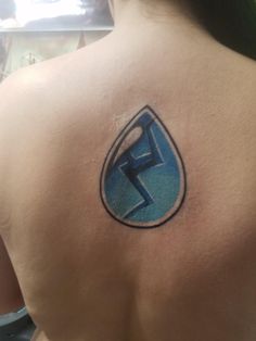 a woman with a tattoo on her back has a blue water drop and a lightning bolt