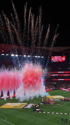 fireworks are set off on the field during a soccer game