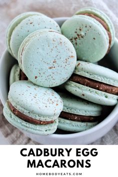 green macaroons in a white bowl with text overlay that reads cadbury egg macaroons