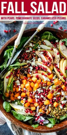 a salad with pears, pomegranate seeds, caramelized pecans and feta cheese