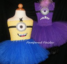 two dresses made to look like minion and monster dolls, one is purple and the other is yellow