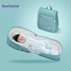 a baby laying in a bed next to a blue lunch box and bag with the name sunveno on it