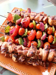 the skewers are filled with meat and vegetables