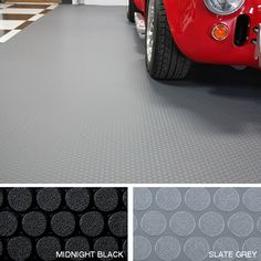 a red car parked in a garage next to a black and white checkered floor