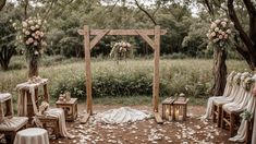 an outdoor wedding setup with white flowers and greenery on the ground, surrounded by wooden chairs