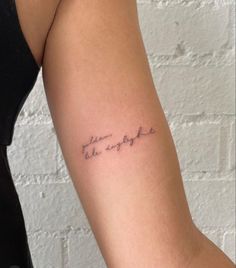 a woman's arm with a tattoo that reads, the strength