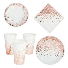 a set of pink and white dinnerware