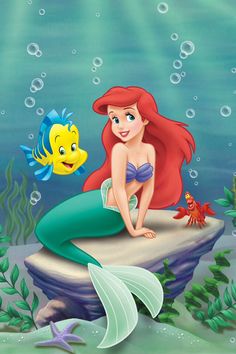 the little mermaid is sitting on top of a rock and looking at an orange fish