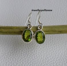 Peridot Jewelry, Peridot Earrings, 925 Earrings Sterling Silver Plated Earrings, Green Earrings, Women Jewelry, Gift Jewelry, Birthday Gift. Details Handmade item Delivery from a small business in India Materials: Silver, Stone Gemstone: Peridot Closure: Ear wire Style: Minimalist Can be personalised Description Gemstone-Peridot Shape-Oval Metal-925 Sterling Silver This One of a kind Earring is adorned with beautiful Green Peridot gemstone set in sterling silver. About gemstones-Green Peridot is Peridot Earrings As A Gift, Handmade Peridot Earrings As Gift, Oval Peridot Earrings For Gift, Green Peridot Earrings For Anniversary, Green Sterling Silver Hallmarked Earrings, Peridot Dangle Earrings Gift, Silver Peridot Dangle Earrings, Peridot Gemstone Dangle Earrings, Green Peridot Dangle Earrings