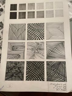 an open book with black and white drawings on it's cover, which includes different patterns