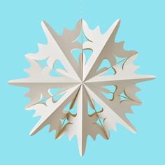 a paper snowflake hanging from a string