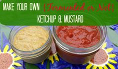 two jars filled with ketchup and mustard sitting on top of a blue plate