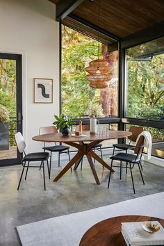 a dining room table with chairs around it