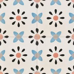 an artistic tile design with blue, pink and black flowers on it's surface