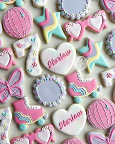 many decorated cookies are displayed on a table