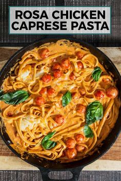 a skillet filled with pasta and tomatoes