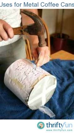 a person is using a hammer to cut paper on a piece of cloth with scissors