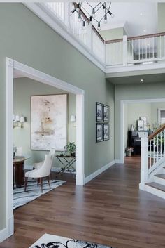 a living room filled with furniture and a staircase