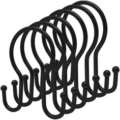 a set of black metal hooks on a white background