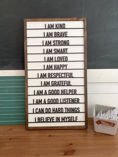 a wooden sign that says i am kind of brave, i am strong and i am loved