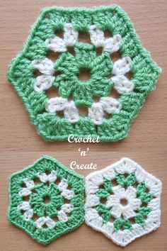 two crocheted coasters on top of a wooden table