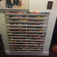 there is a toy car display on the wall