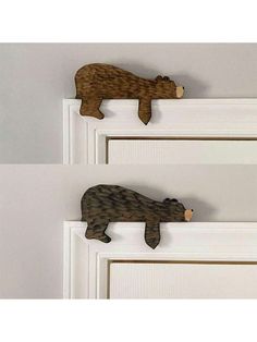 two wooden bears are hanging on the door