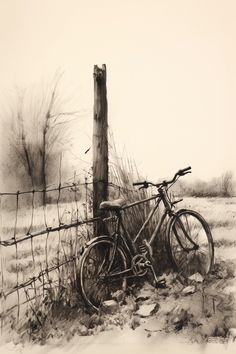 an old bicycle leaning against a fence in the snow by it's post and wire