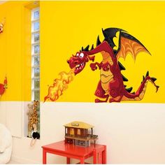 a child's room with yellow walls and a dragon wall decal