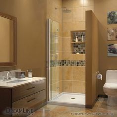 a bathroom with a toilet, sink and shower stall