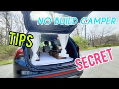 the back end of a car with an open trunk and white drapes on it that says, no build camper tips secret