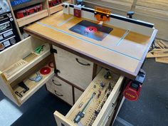 a workbench with drawers and tools in it