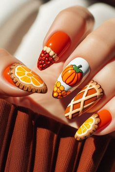 Thanksgiving is a time for gratitude, family, and festive gatherings. Celebrate the season with one of these 25 creative nail designs that reflect the holiday spirit! Fall, ideas, short, art, colors, inspo, snoopy, designs acrylic, easy, simple. Thanksgiving Food Nails, Lemon Nails, Thanksgiving Designs, Food Nails, Thanksgiving Nail Designs, Thanksgiving Nail Art, Thanksgiving Nail, Kiss Nails, Red Acrylic Nails