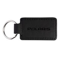 a black leather keychain with the word polaris on it