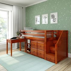 a wooden bunk bed sitting next to a desk with drawers on it in a bedroom