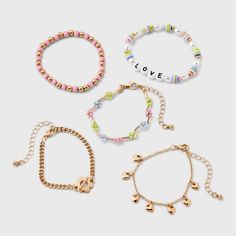 Accessorize your kid's ensemble using this Kids' 5pk Love Bracelet Set by art class™. Featuring a mix of gold bracelets with a secure lobster claw clasp, these hassle-free accessories are perfect for kids on the go. The set of 5 provides versatile options, making it easy to mix and match with a variety of outfits. Elevate your little one’s style with these chic kids love bracelet collection from art class. Art Class™: One-of-a-kind looks for the one and only you Playful Gold Friendship Bracelets With Letter Beads, Playful Gold Jewelry With Heart Beads, Target Art, Class Jewelry, Holiday Bracelets, Chic Kids, Puffy Heart Charms, Rainbow Bracelet, Acrylic Nails Coffin Short