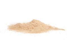 a pile of sand sitting on top of a white table