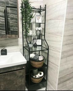 a bathroom with a sink and shelves in it