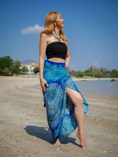 Step into the spirit of boho chic with our Purple Peacock Wrap Skirt. This handmade skirt, perfect for festivals, beach days, and casual lounging, features a beautiful mandala design in a vibrant teal green. Made from premium rayon, this skirt is extremely flowy and comfortable, offering both style and ease. Key Features ‣ Material: Premium Rayon ‣ Design: Teal Green Mandala Print with Side Ties ‣ Comfort: Extremely flowy and comfy ‣ Size: One Size Fits Most (US Women's Numeric 0-16 or S-XL) ‣ Length: 48" ‣ Width: 40" ‣ Special Feature: Hole to insert ties for an adjustable fit ‣ Care: Machine washable, tumble dry Why Choose Our Wrap Skirt? ‣ Handmade Quality: Each skirt is handmade, ensuring unique and high-quality craftsmanship. ‣ Eco-Friendly Fabric: Made from premium rayon, which is en Hippie Rock, Festival Skirt, Green Mandala, Hippie Skirt, Skirt Beach, Purple Peacock, Blue Mandala, Beautiful Mandala, Hippie Skirts