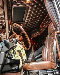 the interior of an old car with leather seats