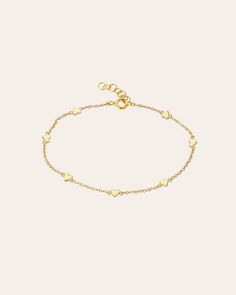 Beautifully handcrafted 14k yellow gold hearts charm bracelet, with approx. 7 small hearts, on a dainty cable link adjustable bracelet chain 6''- 7". A perfect everyday layer bracelet! Chain Length: 6"-7" Total Weight: Approx. 2 grams Ships in 4-7 business day Rush orders ship in 2-4 business days Comes gift ready in a custom Zoe Lev jewelry box. *Eligible for return, per our policy. See here for details. Charm Anklet, Custom Jewelry Box, Gold Hearts, Bracelet Chain, Layered Bracelets, Small Heart, Heart Bracelet, Heart Charm Bracelet, Heart Of Gold