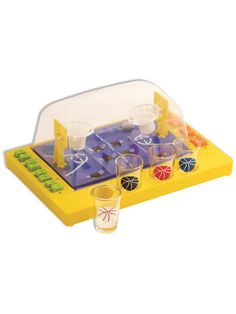 a plastic game set with cups and dices on the board, including two shot glasses