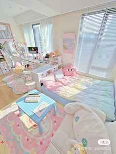 a bedroom with pink and blue decor on the walls, white bedding and rugs